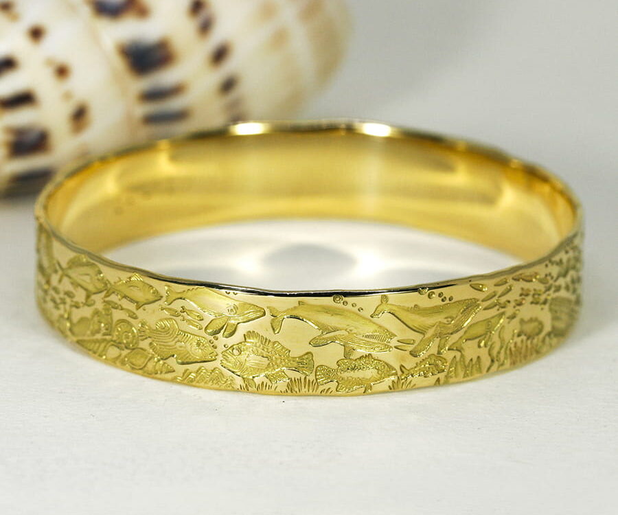 'Oceans of the Universe', 18ct Yellow Gold bangle with an Underwater story theme