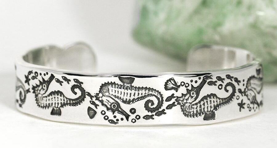 17. 'Seahorse Swim', sterling sivler cuff with scalloped details on the ends