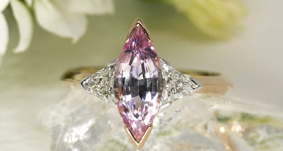 19. 'Magic', 18ct Rose and White Gold, set with a 1.86ct Pink Sapphire and two 0.38ct Diamonds