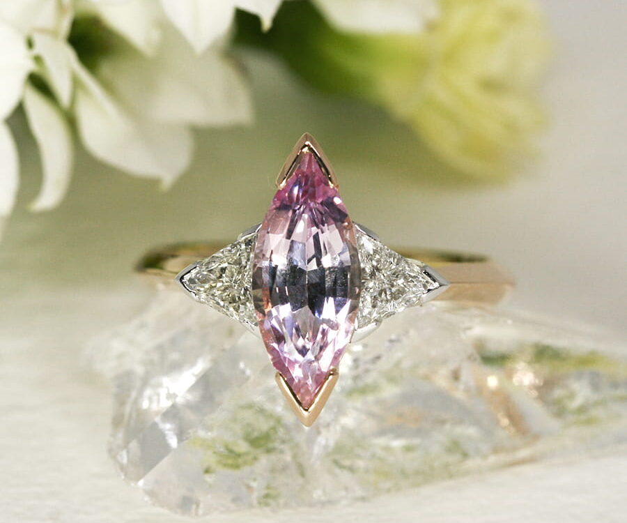 19. 'Magic', 18ct Rose and White Gold, set with a 1.86ct Pink Sapphire and two 0.38ct Diamonds