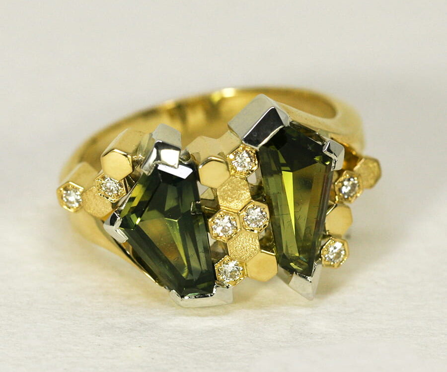 20. 'Manuka', 18ct White and Yellow Gold, set with two Australian Green Sapphires totalling 2.93cts and eight Diamonds totalling 0.12cts