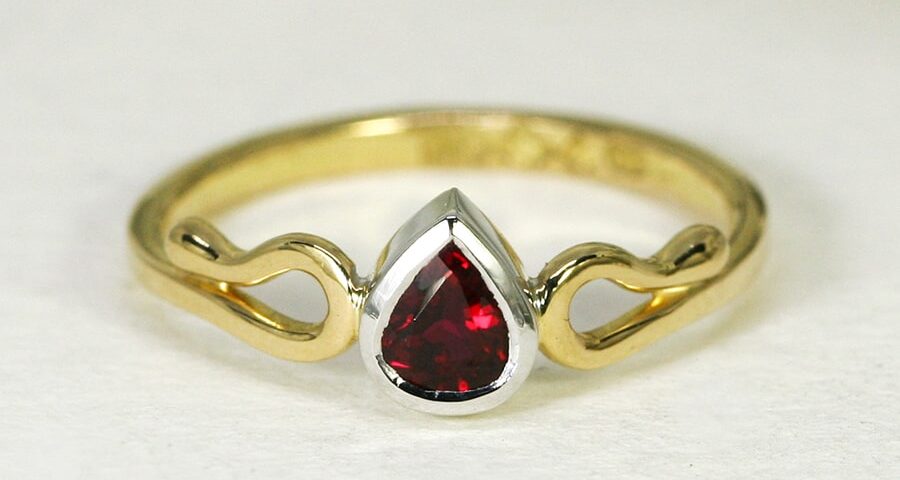 22. 'True Love', 18ct Yellow and White Gold, set with a 50pt Burma Ruby