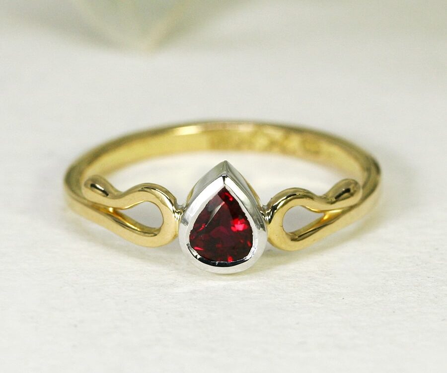 22. 'True Love', 18ct Yellow and White Gold, set with a 50pt Burma Ruby