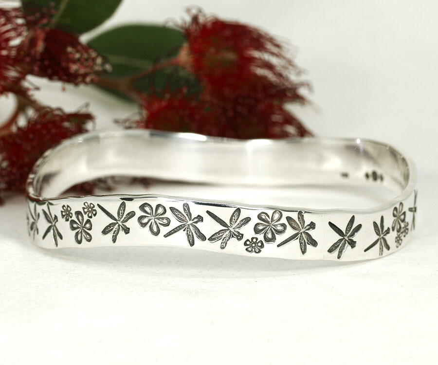 Marrinup Garden sterling silver handcrafted bangle featuring dragonflies flowers