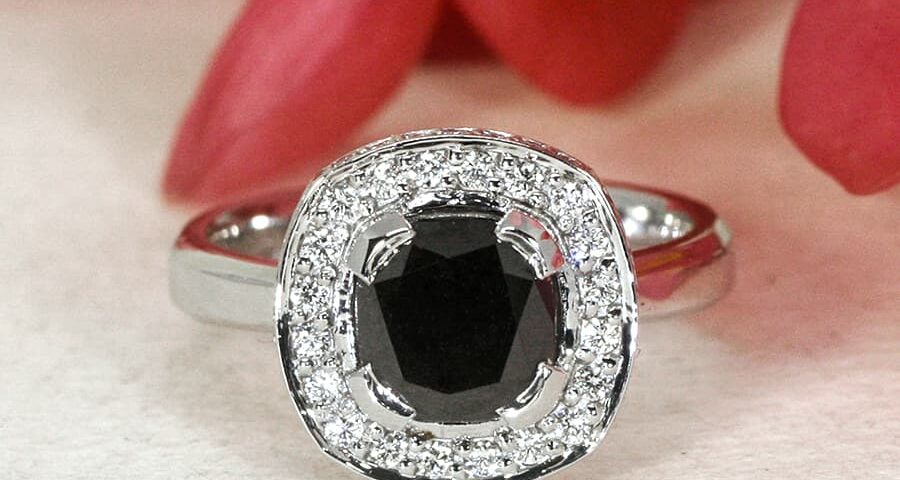 'Beautiful in Black' 18ct white gold ring with black diamond in centre 48 small white diamonds