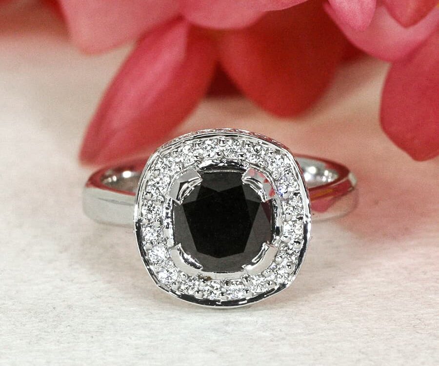 'Beautiful in Black' 18ct white gold ring with black diamond in centre 48 small white diamonds