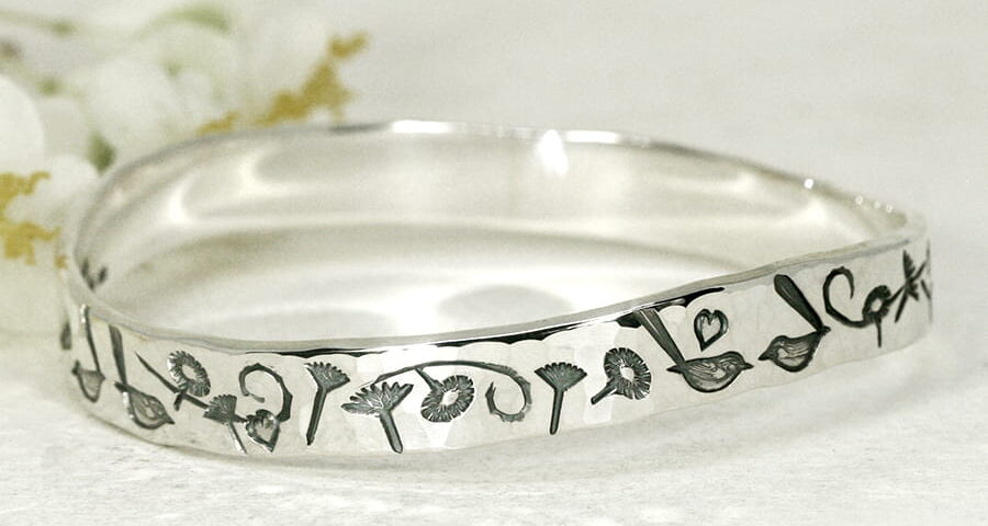 Everlasting Wrens sterling silver bangle with a wave profile