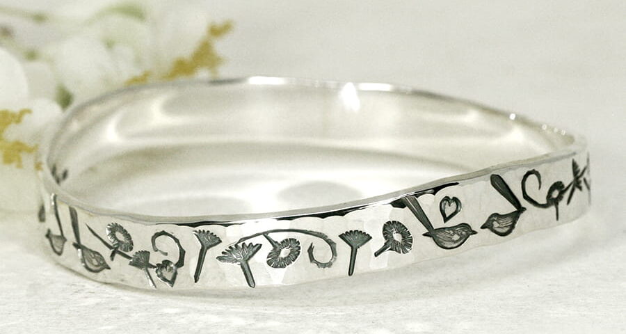 Everlasting Wrens sterling silver bangle with a wave profile