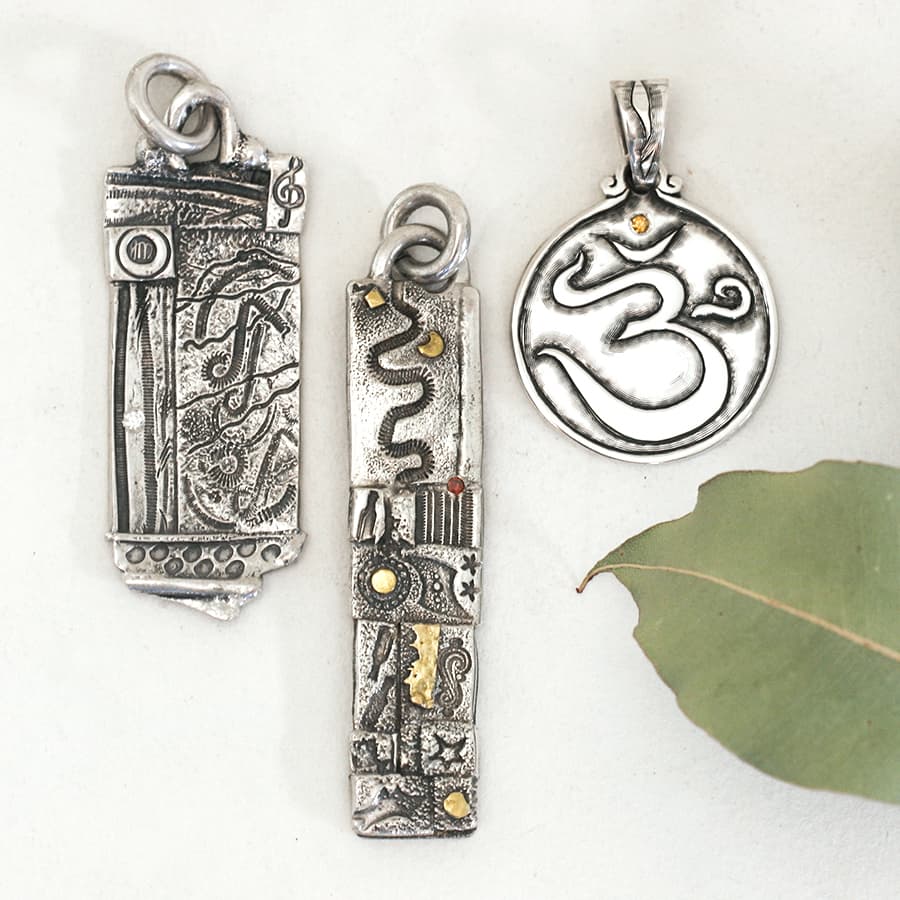 Large mixed fused and hand engraved pendants set with gemstones and diamonds