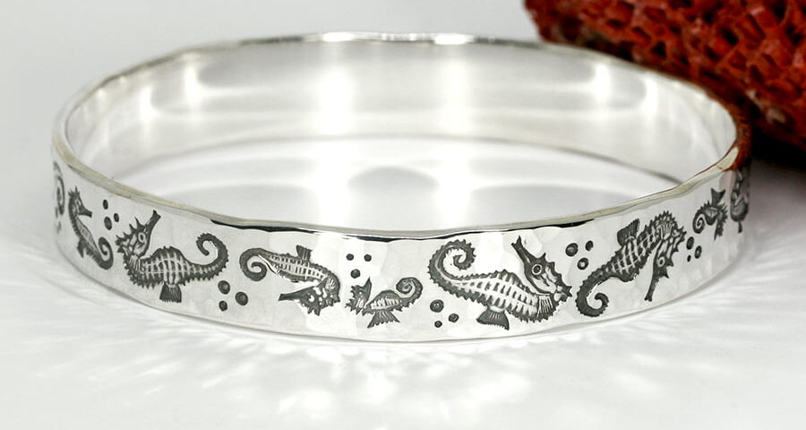 'Seahorse Swim' sterling silver seahorse bangle john miller design