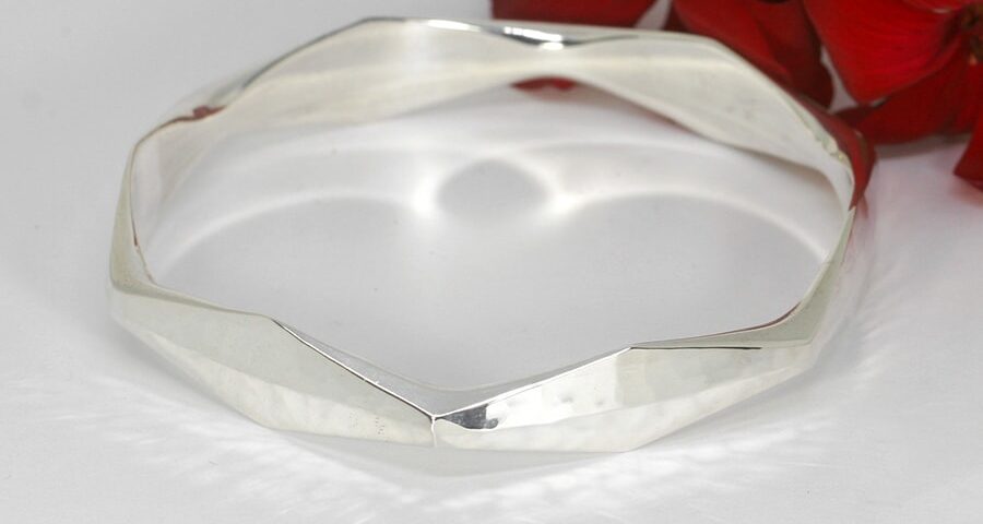 'Bright Facets' handcrafted sterling silver facet bangle with a hammerbeat finish john miller design