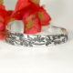 'Flowers and Wrens' sterling silver tapered cuff with Geraldton Wax flowers and Australian wrens