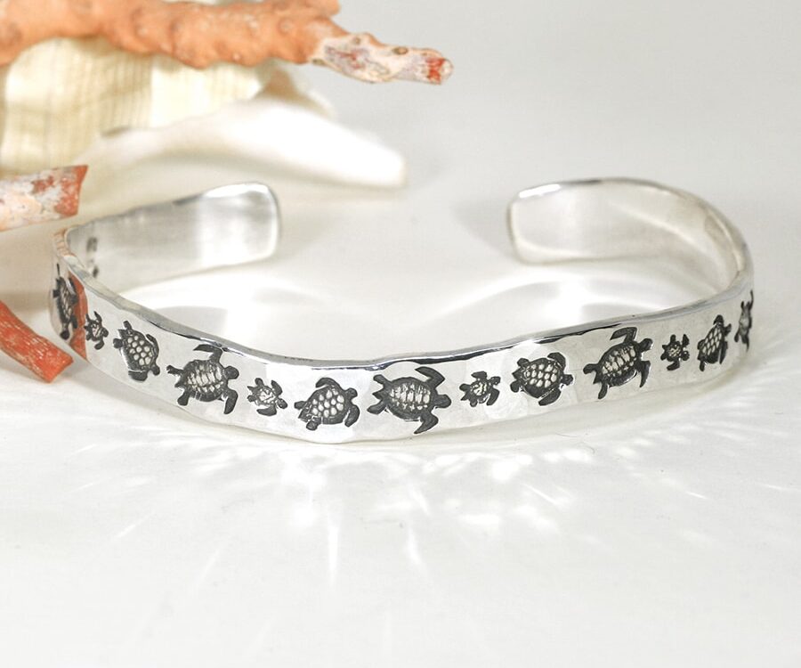'Turtle Family Swim' sterling silver wavey profile cuff with a hammer beat finish john miller design