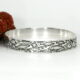 'Underwater Story' sterling silver ocean themed bangle with stamping and hand engraving