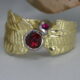 'Ruby Sunrise' 18ct gold patterned ring 2 Burma Rubies totalling 0.75ct set in 18ctwhite gold bezel john miller design