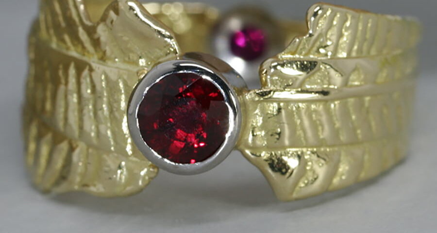 'Ruby Sunrise' 18ct gold patterned ring 2 Burma Rubies totaling 0.75ct set in 18ctwhite gold bezel