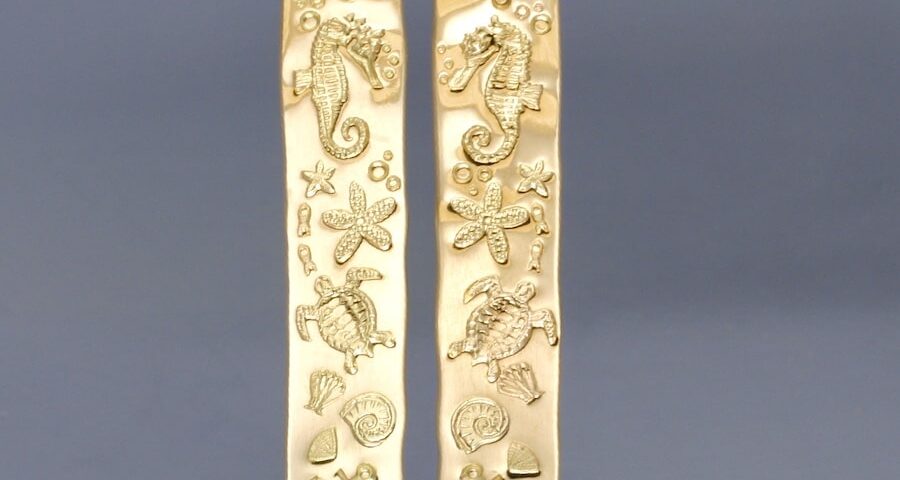18ct gold Ocean design earrings