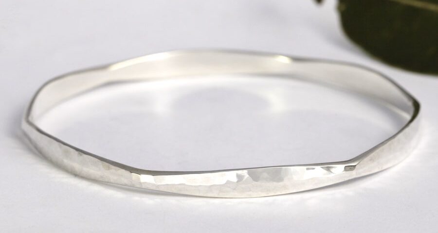 'Hexagonal Delight' forged sterling silver bangle with hammer beat finish john miller design