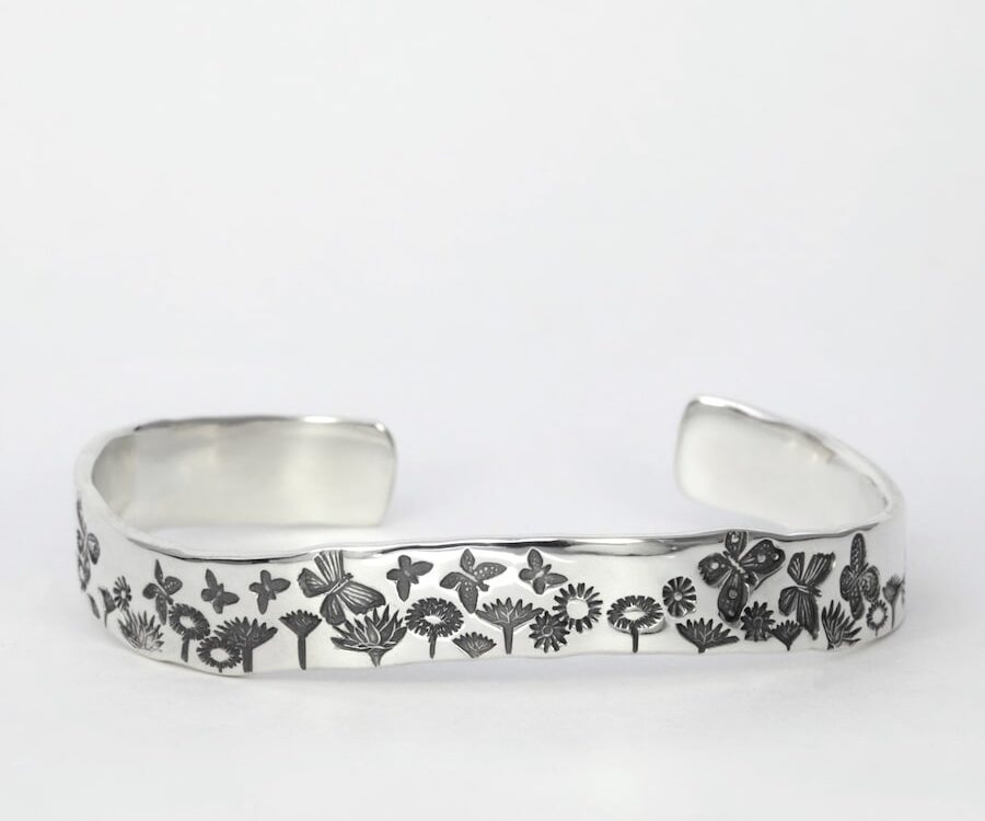 'Celebration of Spring' handcrafted sterling silver cuff with a wave profile john miller design