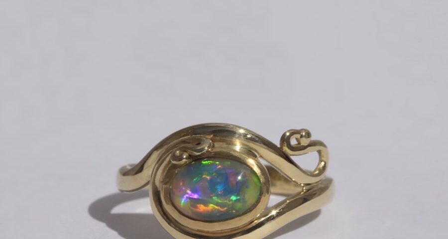 'Life in Colour' 18ct yellow gold and 1.25ct Lightning Ridge black opal ring john miller design