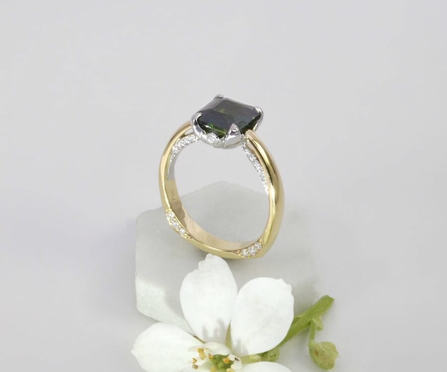 'Lotus' 18ct yellow, white gold ring with a radiant cut 3.36ct teal sapphire and RBC diamonds