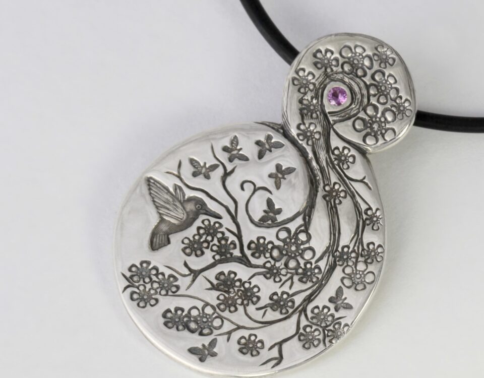 'Garden Swirl' Sterling Silver Flora Fauna Pendant set with a pink sapphire